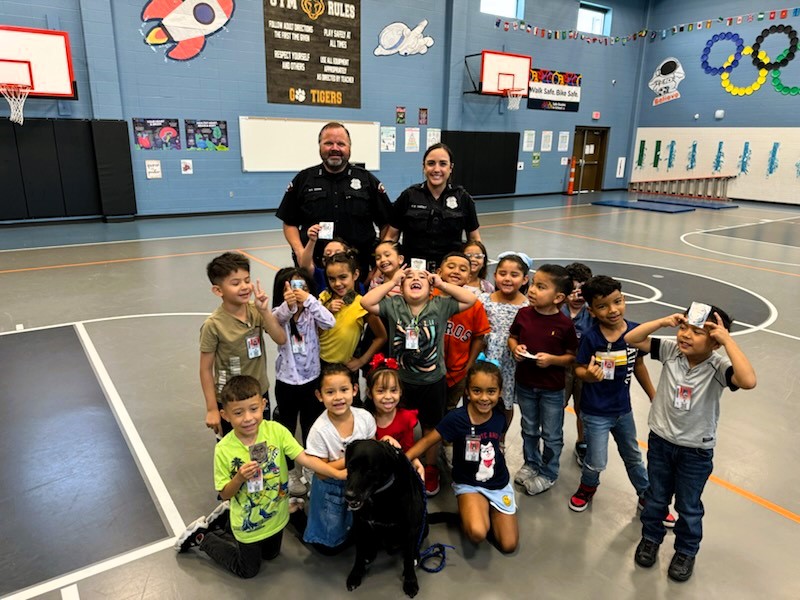 Officers Adams and Haesly, along with K9 JJ, energized LF Smith Elementary with summer safety tips and tumbling challenges.
