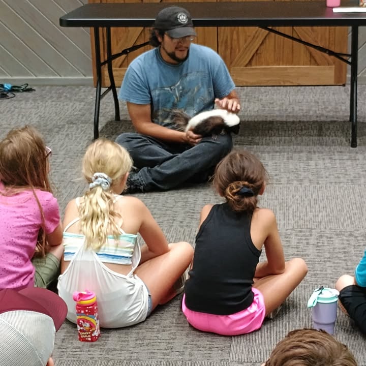 Armand Bayou EcoCampers had an fun day learning from Zoologist Chris while meeting Hana the skunk.